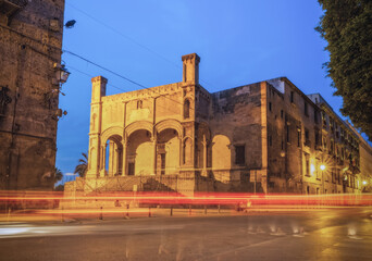 June 2023, Palermo, Sicily, Italy: Street scene at the evening with cars light tracks and phantom footprints from people's feet.. Long exposure.