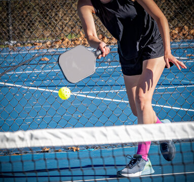 Female pickelball player about to hit a forehand volley
