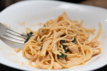 Delicious Italian pasta in a white plate on the table