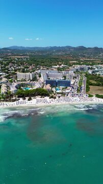 Aerial view of Cala Agulla and beautiful Mallorca. pristine beach, crystal waters, surrounded by nature, perfect Mediterranean escape
