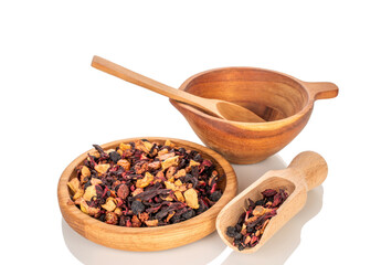 Carpathian forest fragrant tea with wooden utensils, macro, isolated on white background.