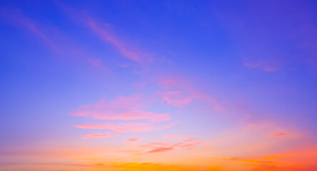 Sunset Sky Background in the Evening with Nature Light and Colorful Orange yellow with Pink Sunlight Cloud on Beautiful Romantic Blue Twilight sky, Summer Fantastic Sunrise sky Backdrop