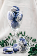 A glass of colorful and unique macarons