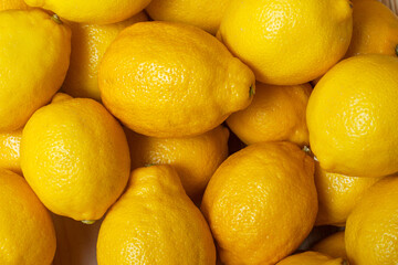 Fresh lemons close-up, background.