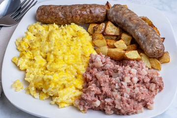 scramble eggs  with corn beef hash  and home fries,