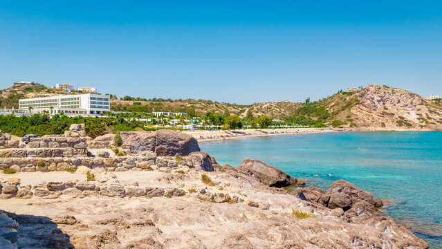 Sunny panoramic view of Agios Stefanos Beach with Kampos village in the background on Kos Island, Greece