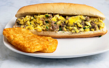 scramle egg and sausage sub  wit hash browns