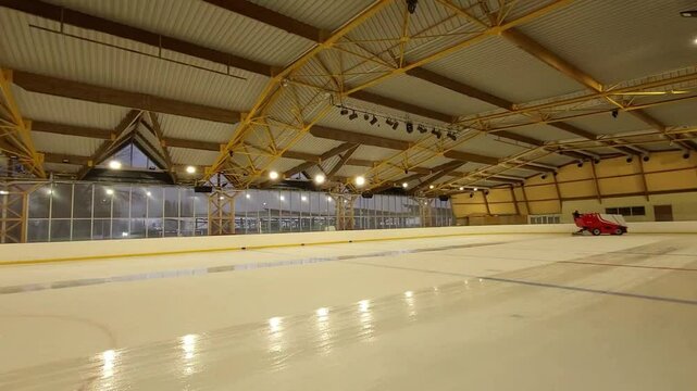An ice resurfacer smooths the ice of an ice rink