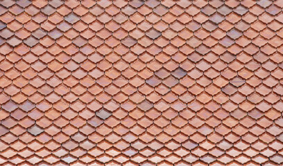 Seamless pattern of red tiles on rooftop.