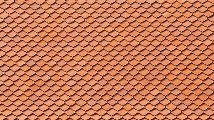 Seamless pattern of orange tiles on rooftop.