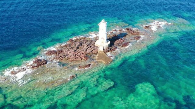 Mangiabarche lighthouse with high waves. Mangiabarche is the lighthouse located in Calasetta southwest Sardinia Italy