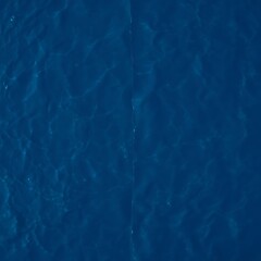 Deep blue water surface texture.