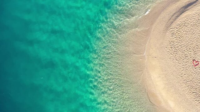 red heart on the beach, Aerial view of one of Croatia's most famous beaches - Zlatni Rat near Bol town on Brac island in Croatia.