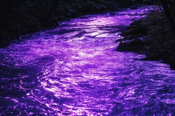 Obraz premium Purple River Water Flowing Through Dark Rocks