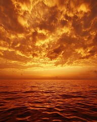 Fototapeta premium Surreal sunset over calm ocean fiery skies seascape dreamy atmosphere wide angle view