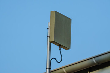 A small antenna is attached to a metal pole