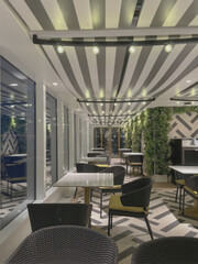 Modern contemporary colorful interior design inside speciality dining a la carte restaurant onboard...