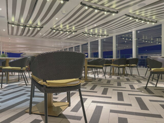 Modern contemporary colorful interior design inside speciality dining a la carte restaurant onboard...