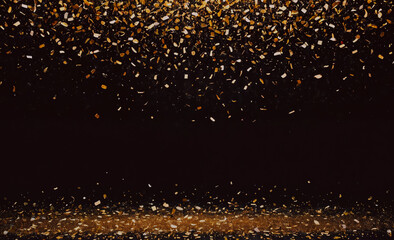 A black background with gold confetti falling from the sky. The confetti is scattered all over the background, creating a festive and celebratory atmosphere
