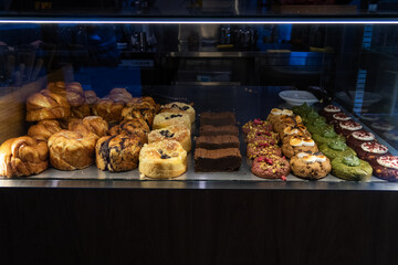 showcase with delicious pastries in a cafe