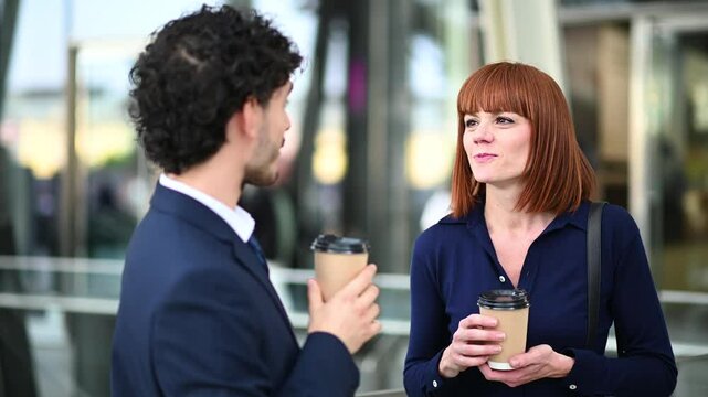 Business partners enjoying coffee break during corporate event