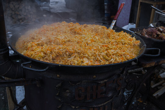 Bigus, stewed cabbage in a cauldron at a street fair, street food