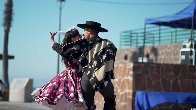  Chilean Huaso dancers performing cueca, traditional chilean dance, during outdoor celebration