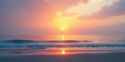 Naklejka premium Serene Ocean Sunset with Gentle Waves Rolling Ashore on a Sandy Beach