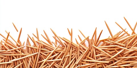 Fototapeta premium Cluster of Wooden Toothpicks on a Bright White Surface