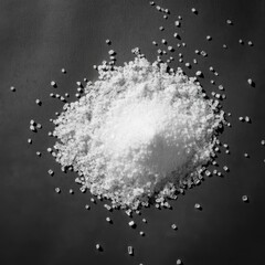 Black and white photography, extreme close-up, coarse salt crystals, rough wooden surface, grainy texture, shallow depth of field, monochromatic, high contrast, culinary still life, minimalist composi