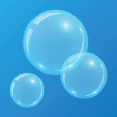 Bright blue soap bubbles isolated on blue background close up