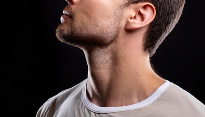 Naklejka premium Close up portrait of a man on a black background