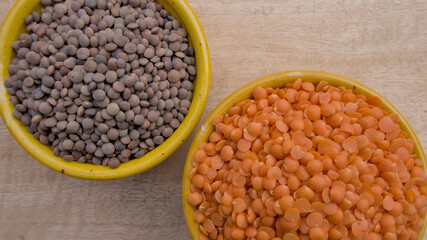 Split Red Lentils and Whole Brown Lentils in Yellow Bowl Top View - Healthy Legume Comparison