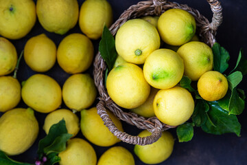 Fresh ripe lemons with green leaves