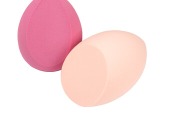 Several makeup sponges isolated on a white background.