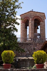 Bell tower in one of the Meteora monasteries in Greece. Architecture of a medieval monastery.
