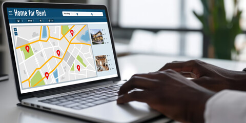 Online real estate rental search brisk on computer. House home or apartment rental website online.