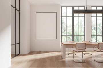 Modern coworking office interior with a blank poster template on the wall, large windows with natural light, and a minimalistic design. 3D Rendering