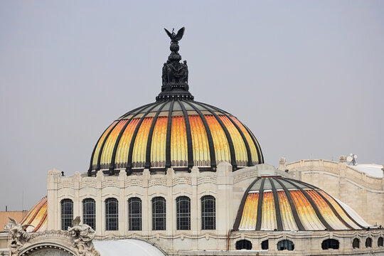 dome roof of Palacio de Bella Artes with Victoria statue on top in Mexico City