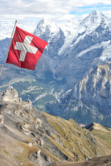 Flag of Switzerland in front of a beautiful mountain panorama