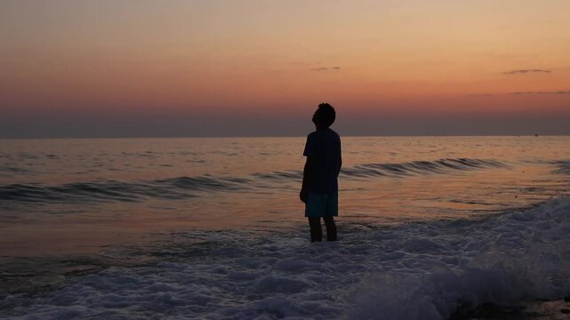 Depressed man on beach during sunset