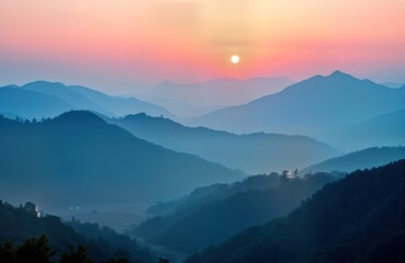 Fototapeta premium Majestic mountain range at sunrise. Soft gradients of blue, pink sky meet mountain silhouettes. Peaceful morning light bathes landscape. Dramatic colours, shapes in nature scenery. Misty mountain