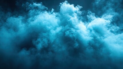 Fototapeta premium Ethereal blue smoke swirling dramatically against a dark background, creating a mystical atmosphere