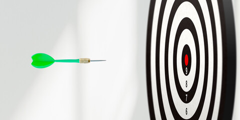 Dart flying toward the center of a black-and-white target, symbolizing focus, precision, and...