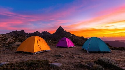 Colorful tents at sunset, mountain camping adventure. Landscape photography for travel brochures