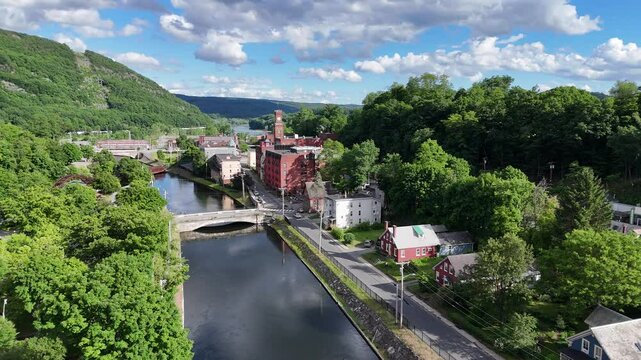 Bellows Falls, VT stock drone video of the small downtown area in the incorporated village located in Rockingham, Vermont on a summer day