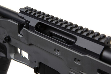 A modern, gray precision rifle with a long barrel, adjustable stock, and tactical design, suitable...