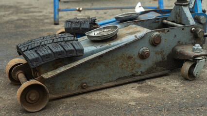 Discover vintage pneumatic jacks at a tire change service, showcasing the evolution of automotive...