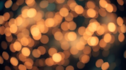 Obraz premium Golden bokeh lights creating a soft, blurred effect on a dark background