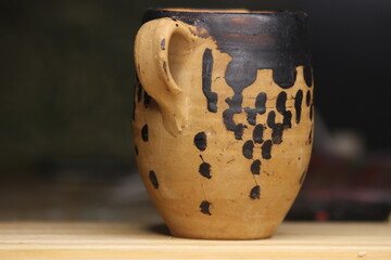 Close up of a pottery cup on a table